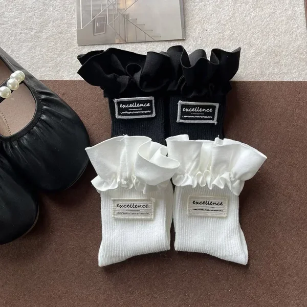 1 paio di calzini al polpaccio per bambini alla moda Semplicity Ins per ragazza Calzini con volant di colore bianco nero per bambini Calzino scolastico primaverile in morbido cotone 4