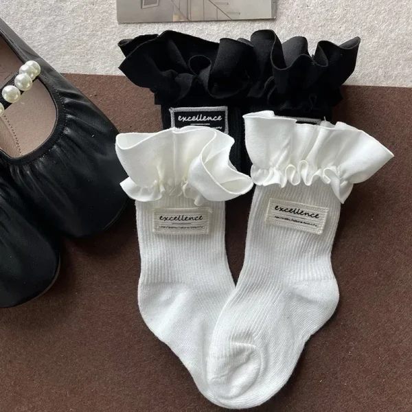 1 paio di calzini al polpaccio per bambini alla moda Semplicity Ins per ragazza Calzini con volant di colore bianco nero per bambini Calzino scolastico primaverile in morbido cotone 3