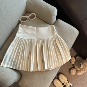 Gonna a pieghe da vacanza a vita alta solida autunno e inverno Donna Elegante stile college Gonna corta sexy versatile Semplice alla moda 1