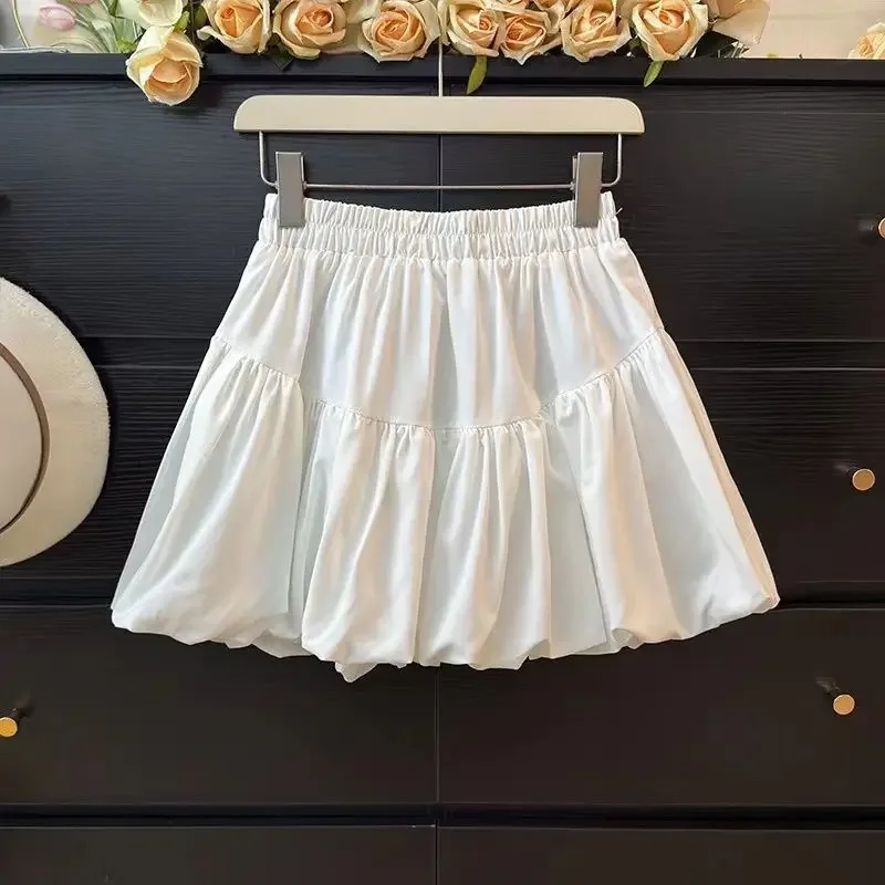 Gonna a bocciolo di fiore nera alla moda a vita alta da donna Torta a mezza lunghezza Minigonna gonfia alla moda Tinta unita semplice 2