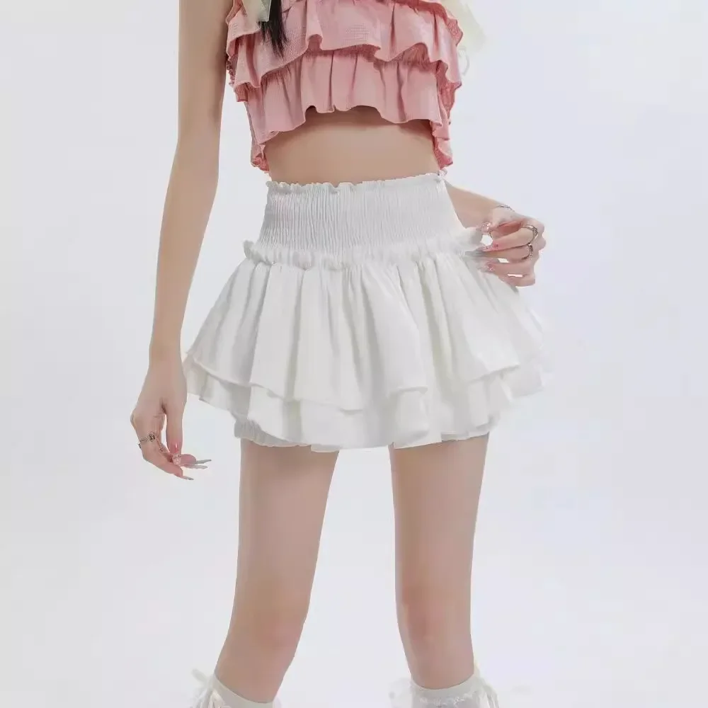 Gonna corta bianca a vita alta con torta Gonna a pieghe in miniatura gonfia anti-luce che previene l'esposizione Pantaloni con gonna in fibra di poliestere 1