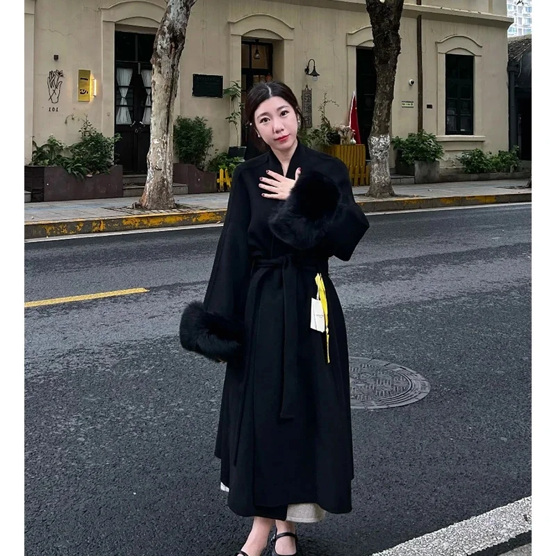 Cappotto di lana con polsino stile Hepburn Cappotto invernale da donna 2025 Nuovo cappotto di lana stile medio lungo con lacci spessi Tinta unita 5