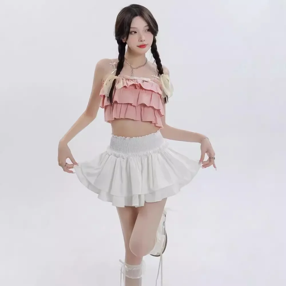 Gonna corta bianca a vita alta con torta Gonna a pieghe in miniatura gonfia anti-luce che previene l'esposizione Pantaloni con gonna in fibra di poliestere 4