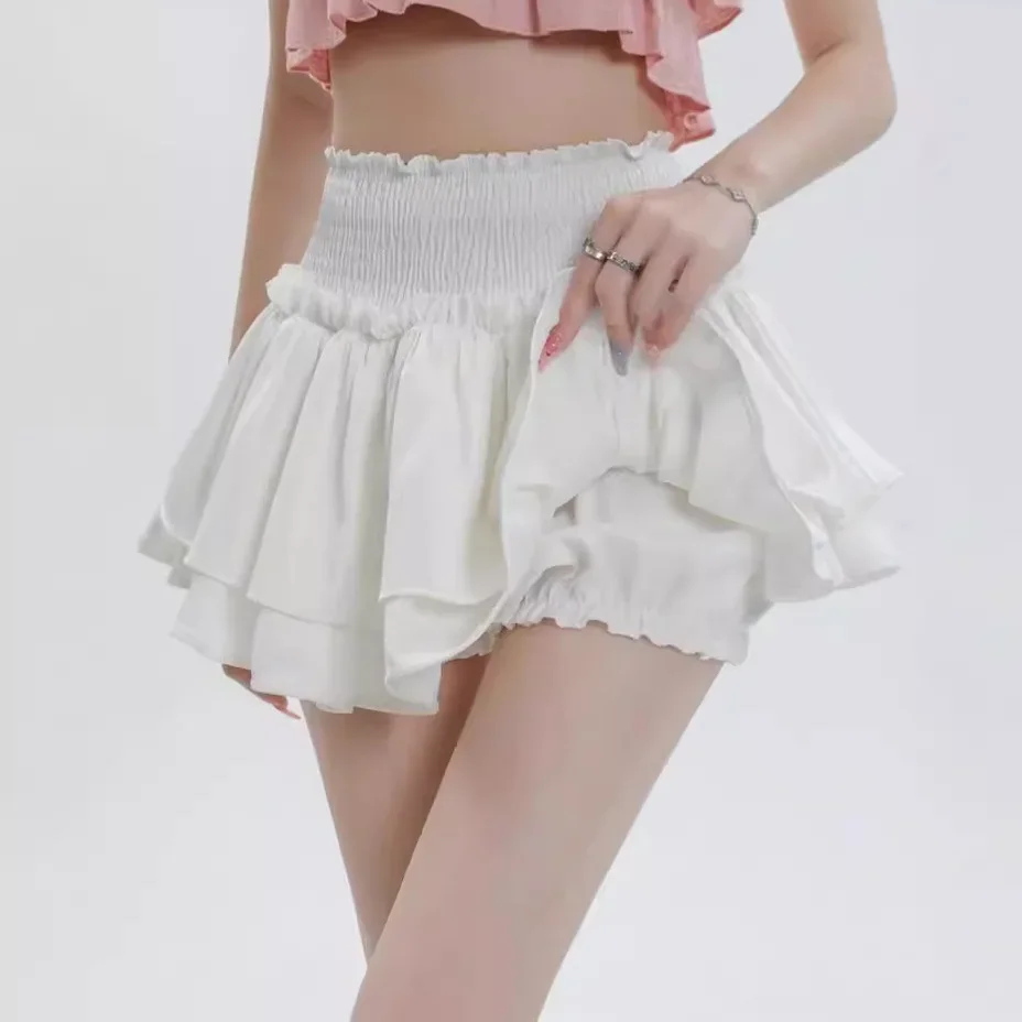 Gonna corta bianca a vita alta con torta Gonna a pieghe in miniatura gonfia anti-luce che previene l'esposizione Pantaloni con gonna in fibra di poliestere 2