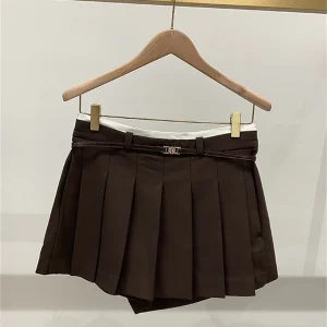 Gonna corta a trapezio in tinta unita Gonna corta da donna a pieghe a vita alta con fascia alla moda 2025 Autunno Nuovo tutto-fiammifero 1