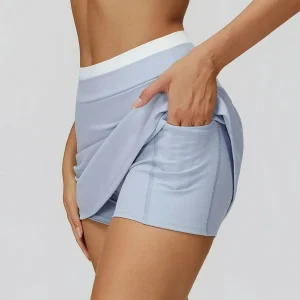 Gonna corta da yoga a costine con blocchi di colore Gonna sportiva a metà corpo a vita alta Gonna da tennis antiscivolo Gonna da allenamento per donna ad asciugatura rapida 1