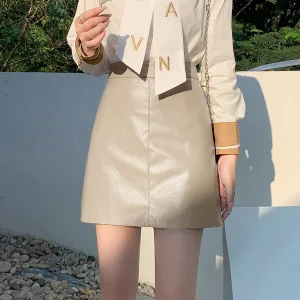 Gonna corta da donna a vita alta mini gonna a trapezio in pelle PU nera che dimagrisce stile elegante stagione autunno inverno sexy alla moda 1