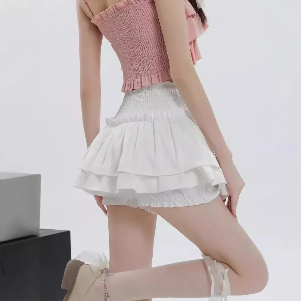 Gonna corta bianca a vita alta con torta Gonna a pieghe in miniatura gonfia anti-luce che previene l'esposizione Pantaloni con gonna in fibra di poliestere 3