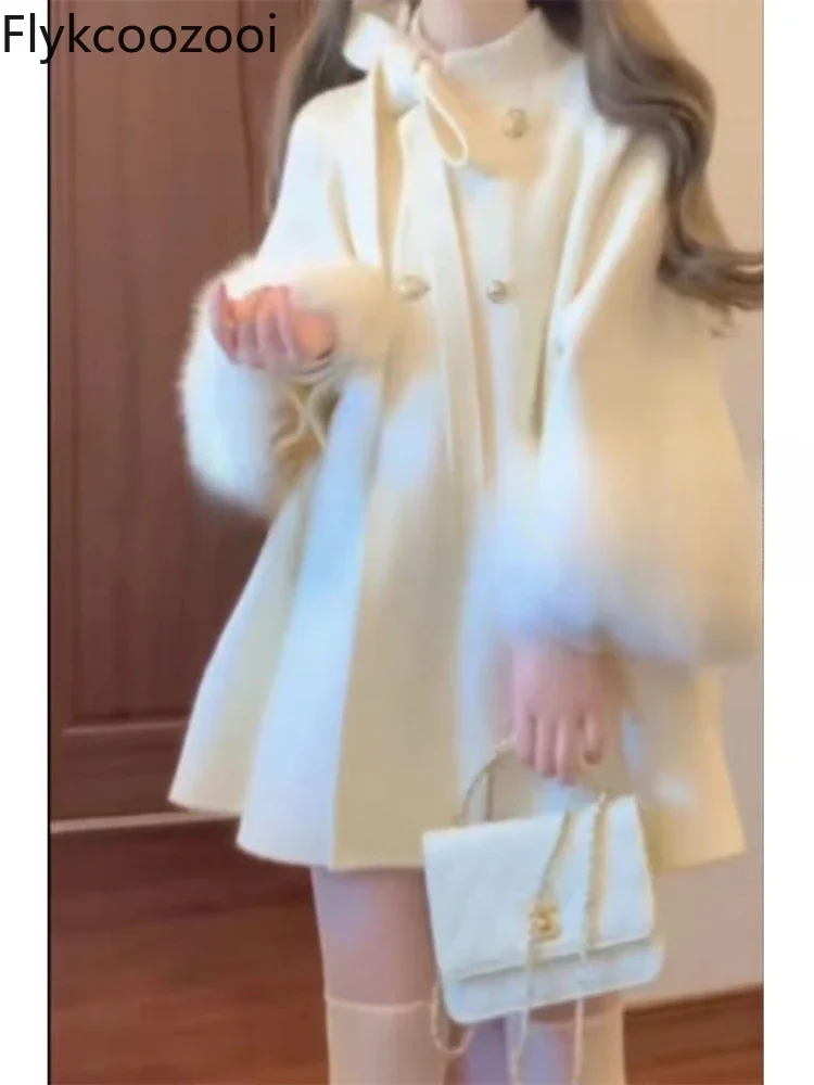 Cappotto di lana con mantello con fiocco in stile coreano per 2024 Autunno e inverno Nuovo stile Piccolo design Jaqueta Feminina Giacca invernale da donna 2