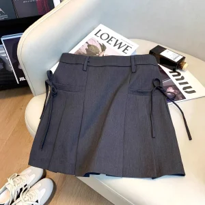 Minigonna a linea A a vita alta con nodo a farfalla Gonne a metà corpo dimagranti versatili alla moda Gonne corte in fibra di poliestere 1